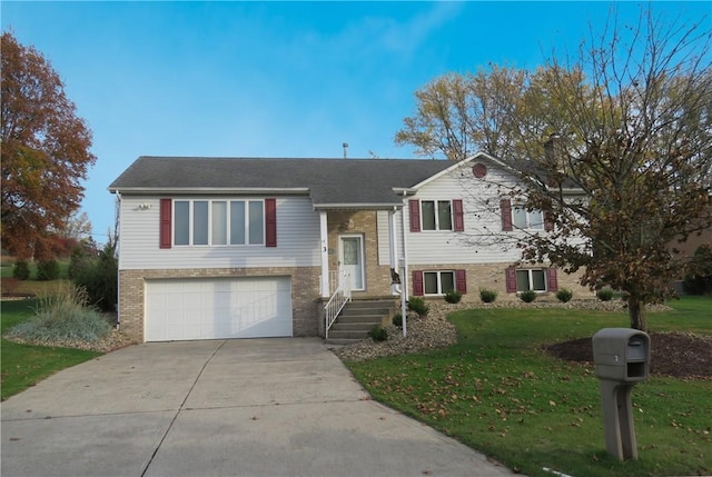 bi-level home with a garage and a front lawn