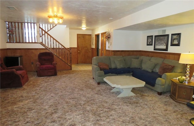 carpeted living room with a textured ceiling