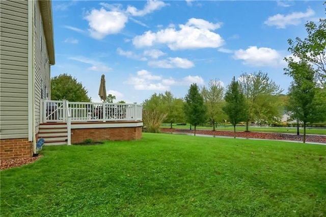 view of yard with a deck