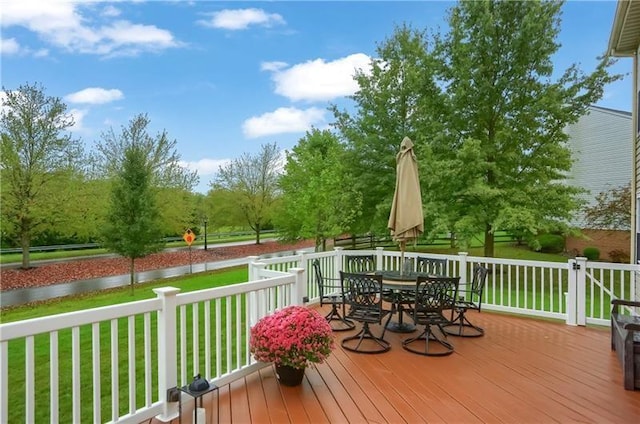 wooden deck with a yard