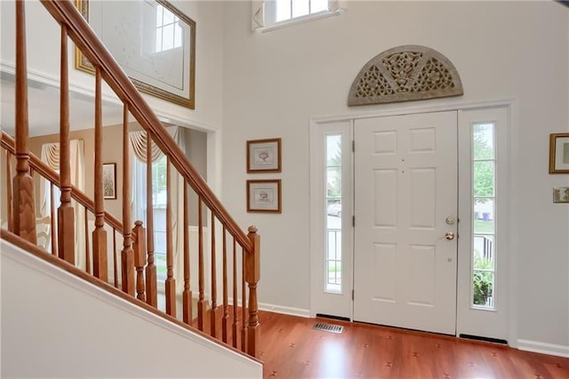 entryway with hardwood / wood-style flooring