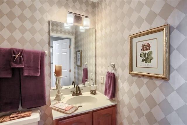 bathroom with vanity and toilet