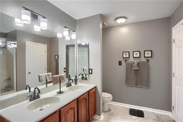 full bathroom featuring bathtub / shower combination, vanity, and toilet