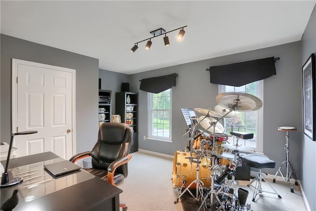 office area featuring carpet flooring and rail lighting