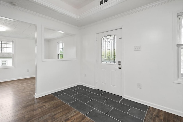 foyer entrance with dark hardwood / wood-style flooring and ornamental molding