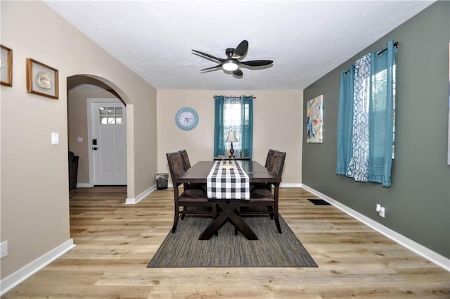 dining space featuring light hardwood / wood-style floors and ceiling fan