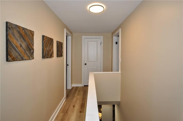 hall with light hardwood / wood-style floors