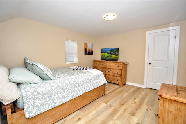 bedroom with hardwood / wood-style floors