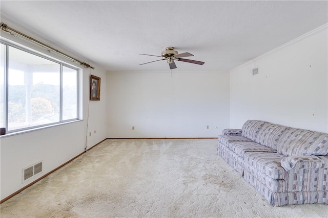 carpeted living room with ceiling fan