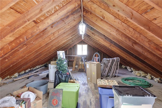 unfinished attic with washer / dryer