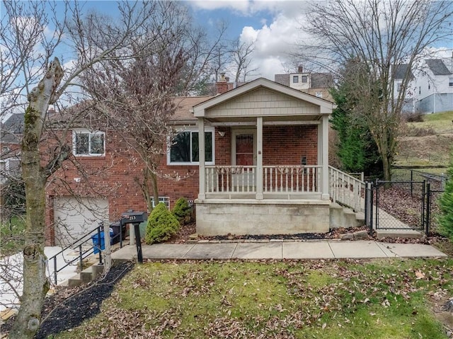 view of front of property featuring a garage and a porch