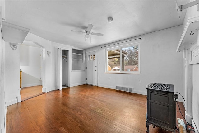 interior space featuring ceiling fan and wood-type flooring