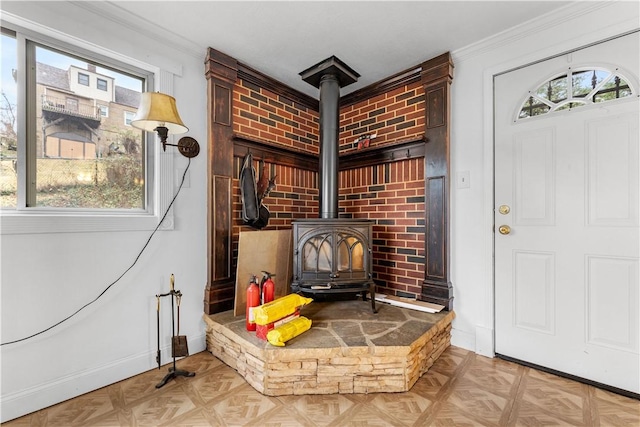 interior details with crown molding, parquet flooring, and a wood stove