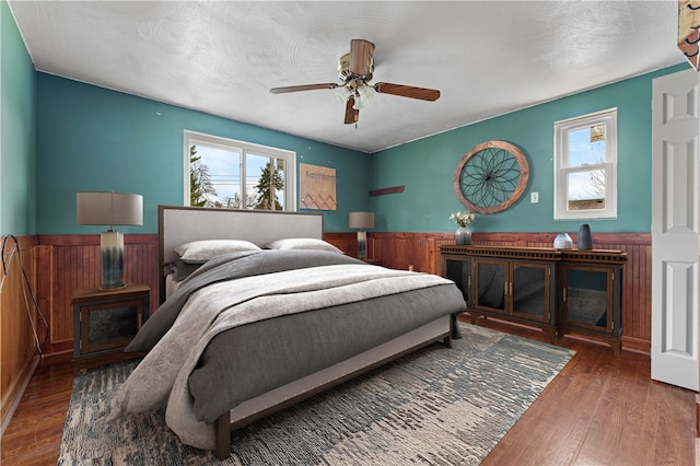 bedroom featuring ceiling fan and dark hardwood / wood-style flooring