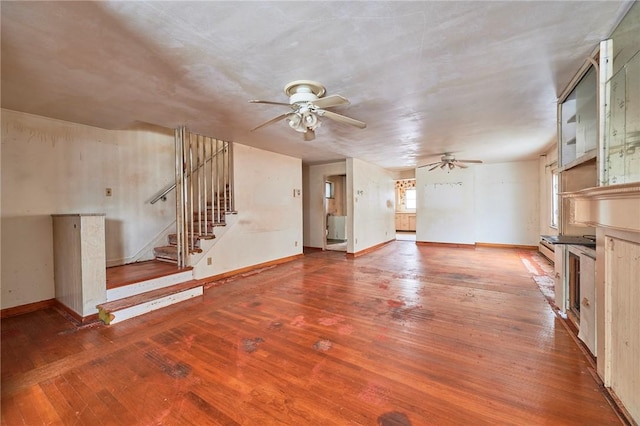 unfurnished living room with hardwood / wood-style floors and ceiling fan