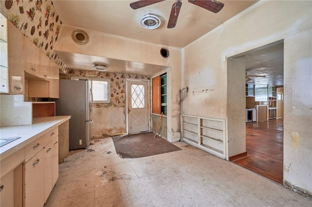 kitchen with stainless steel fridge and ceiling fan