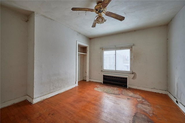 unfurnished room with hardwood / wood-style floors and ceiling fan