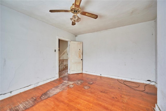 spare room featuring ceiling fan and hardwood / wood-style floors