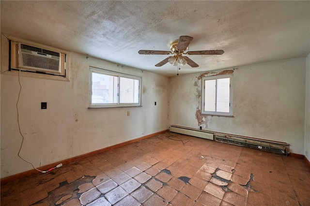 unfurnished room with a wall mounted air conditioner, a baseboard radiator, plenty of natural light, and ceiling fan