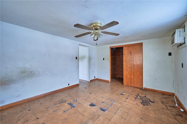 unfurnished bedroom with ceiling fan and a closet