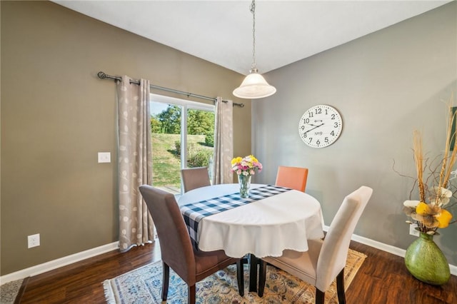 dining room with dark hardwood / wood-style floors