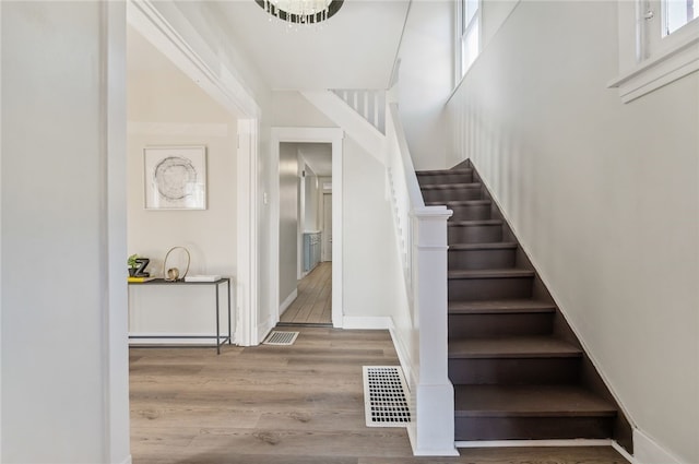 staircase featuring hardwood / wood-style floors