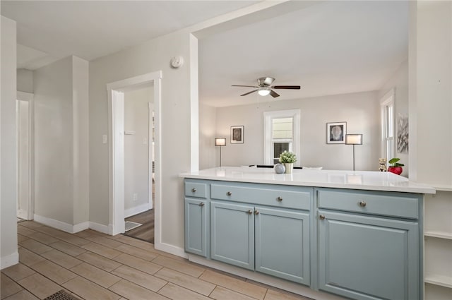 kitchen with ceiling fan and kitchen peninsula