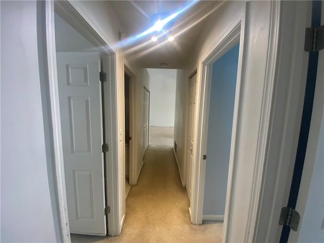 hallway with light carpet