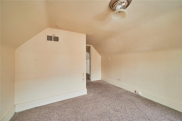 bonus room featuring carpet floors and vaulted ceiling