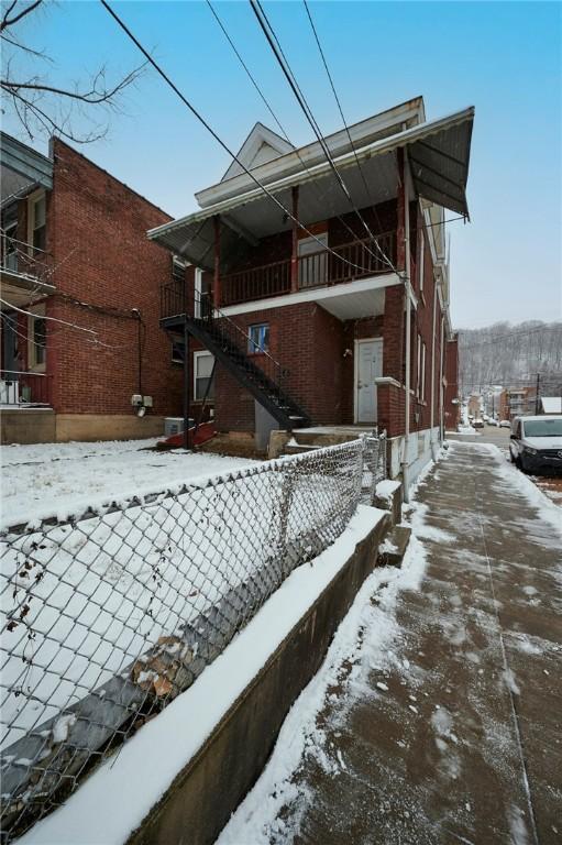 view of snow covered property