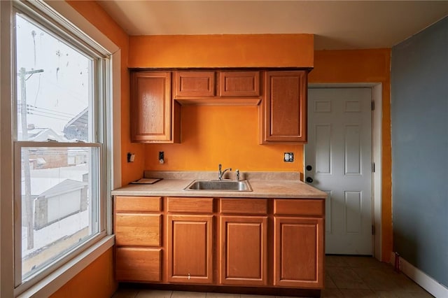 kitchen with sink and light tile patterned floors