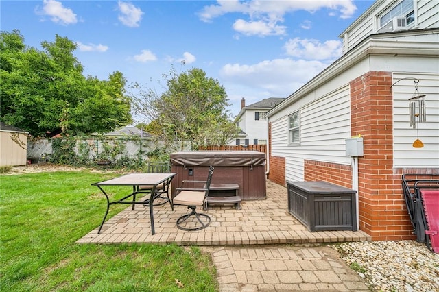 view of patio / terrace with a hot tub