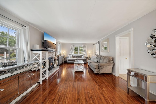 living room with dark wood-type flooring and a wealth of natural light