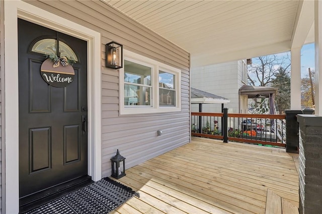 wooden terrace with a porch