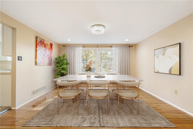 dining area with light wood-type flooring