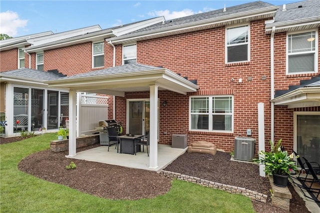 back of house with central air condition unit and a patio