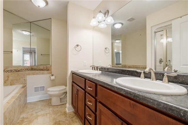 full bathroom featuring vanity, toilet, and independent shower and bath