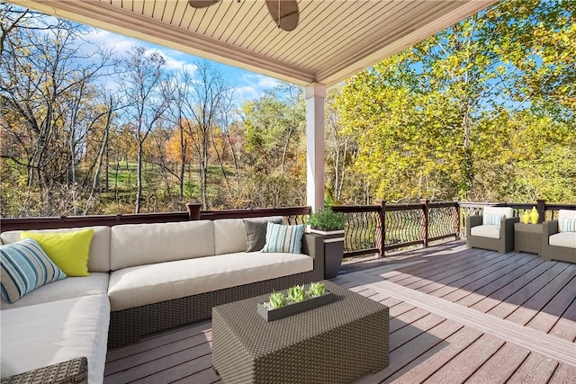 deck featuring an outdoor living space and ceiling fan