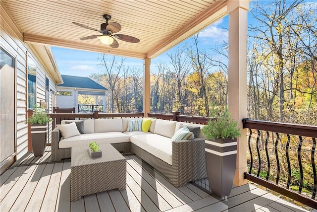 deck with an outdoor hangout area and ceiling fan