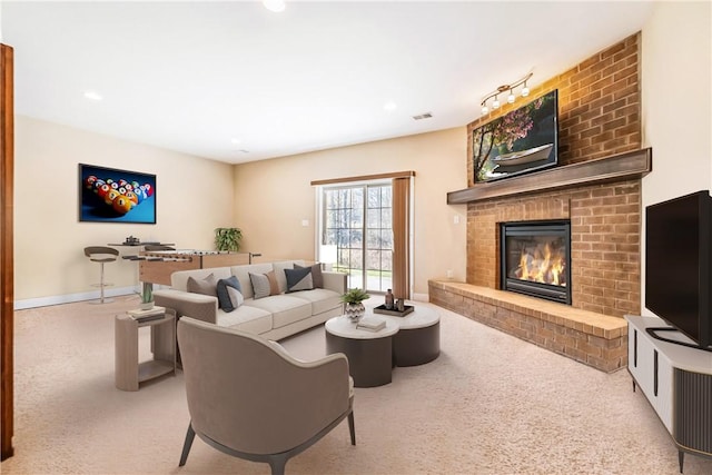 carpeted living room featuring a brick fireplace