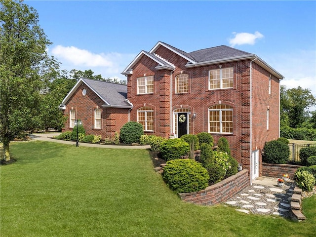 view of front of home with a front lawn