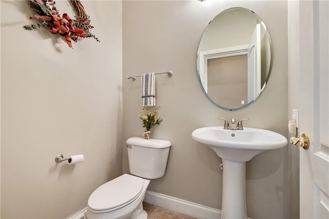 bathroom featuring sink and toilet