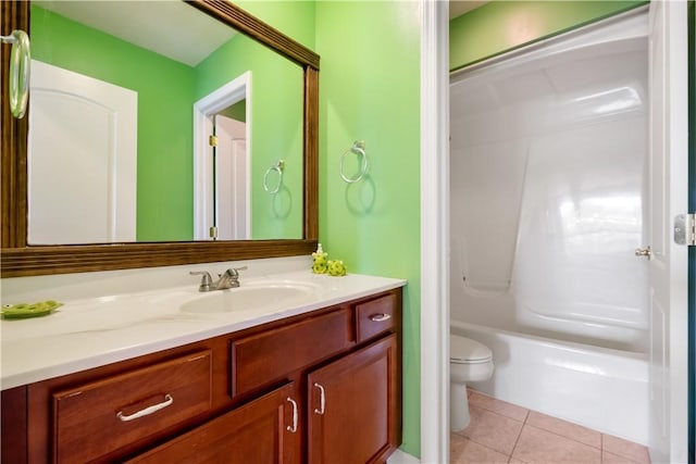 full bathroom featuring washtub / shower combination, tile patterned floors, vanity, and toilet