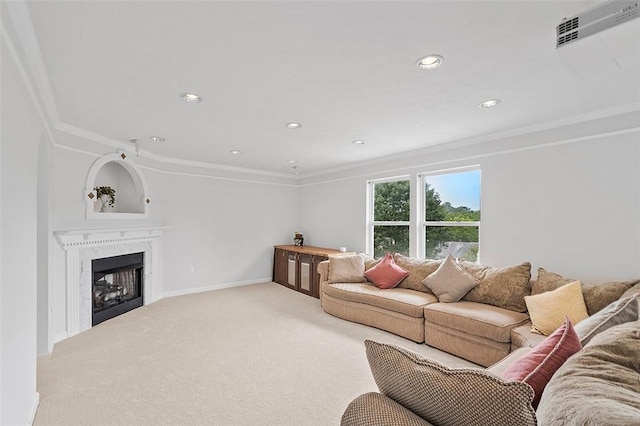 carpeted living room featuring a high end fireplace and crown molding