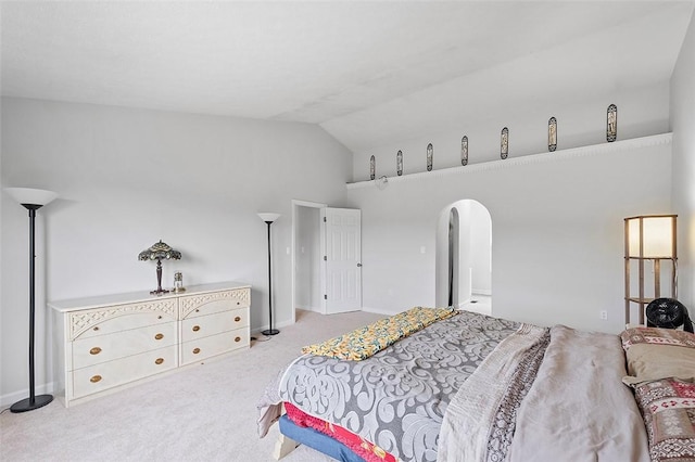 carpeted bedroom featuring lofted ceiling