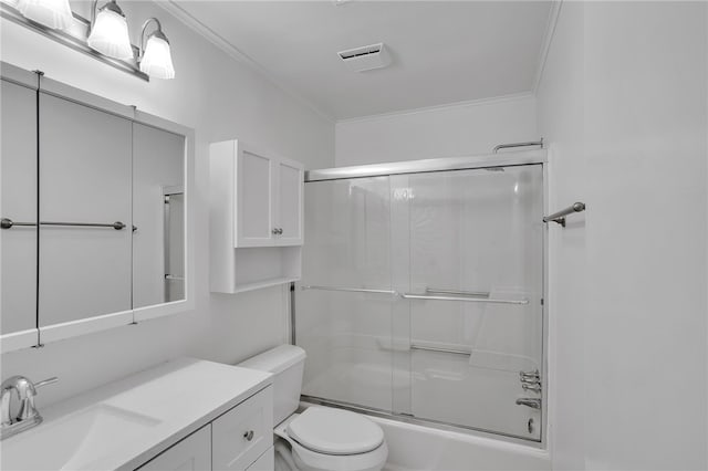 full bathroom featuring enclosed tub / shower combo, vanity, ornamental molding, and toilet