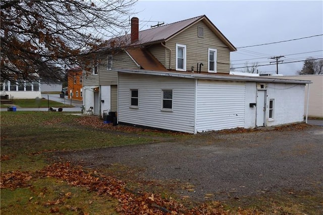 back of property featuring a garage