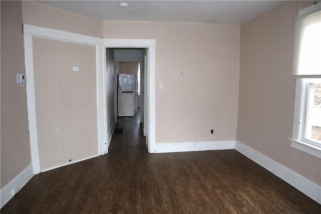 spare room with dark hardwood / wood-style floors