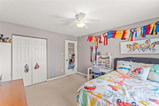 bedroom featuring carpet flooring, a closet, and ceiling fan