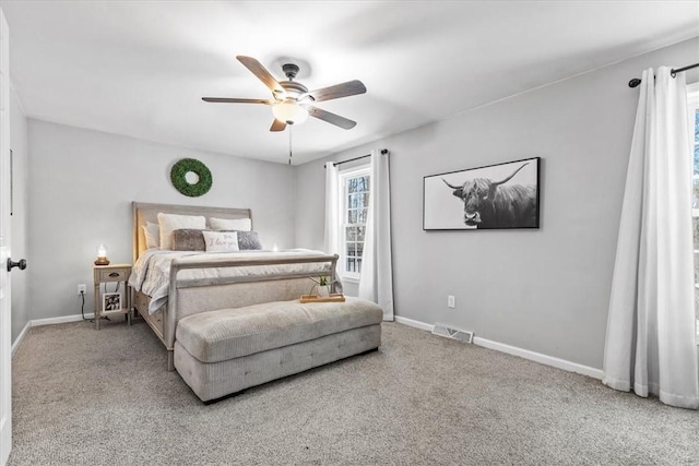 carpeted bedroom featuring ceiling fan